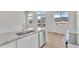Kitchen sink with granite countertops and stainless steel appliances that open into the living area with mountain views at 241 N Front St # 103, Monument, CO 80132