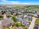 Panoramic aerial view of a sprawling neighborhood with diverse home styles at 18056 E 104Th Way, Commerce City, CO 80022
