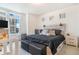 Cozy bedroom features a modern rustic headboard and bright, natural light at 18056 E 104Th Way, Commerce City, CO 80022