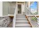 Inviting front entrance with modern railings and gray stairs at 18056 E 104Th Way, Commerce City, CO 80022