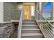 Inviting front entrance with modern railings and updated exterior lighting for a welcoming feel at 18056 E 104Th Way, Commerce City, CO 80022