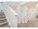 Bright hallway featuring stairs and a conveniently located coat rack at 18056 E 104Th Way, Commerce City, CO 80022