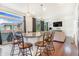Open-concept kitchen with granite island and pendant lighting fixtures at 18056 E 104Th Way, Commerce City, CO 80022