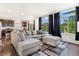 Spacious living room with large windows and comfortable sectional sofa at 18056 E 104Th Way, Commerce City, CO 80022