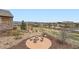 Aerial view of a firepit in a backyard with mountain views in the distance at 10646 Winding Pine Pt, Highlands Ranch, CO 80126