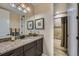 Modern bathroom featuring granite countertops and a shower-tub combination at 10646 Winding Pine Pt, Highlands Ranch, CO 80126