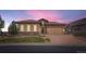 Beautiful single Gathering home featuring a stone and stucco exterior with a meticulously maintained front yard at 10646 Winding Pine Pt, Highlands Ranch, CO 80126