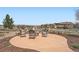 Outdoor firepit area with seating, surrounded by well-maintained landscaping and views at 10646 Winding Pine Pt, Highlands Ranch, CO 80126