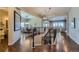 Elegant foyer featuring a curved staircase, hardwood floors, and an open view of the dining and living areas at 10646 Winding Pine Pt, Highlands Ranch, CO 80126