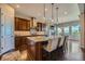 Modern kitchen featuring granite countertops, a large island, and stainless steel appliances at 10646 Winding Pine Pt, Highlands Ranch, CO 80126