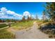 Picturesque community walking path with lush greenery and scenic views at 10646 Winding Pine Pt, Highlands Ranch, CO 80126
