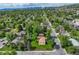 An aerial view captures this home in a neighborhood full of mature trees at 12162 W Dakota Dr, Lakewood, CO 80228