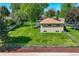 Aerial view of spacious backyard featuring lush green lawn surrounding brick home at 12162 W Dakota Dr, Lakewood, CO 80228