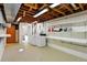 Basement laundry room with washer, dryer and white shelving at 12162 W Dakota Dr, Lakewood, CO 80228