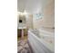Relax in this luxurious bathroom featuring a jetted tub and elegant fixtures; a private retreat at 12162 W Dakota Dr, Lakewood, CO 80228