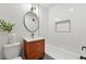 Updated bathroom featuring modern vanity, white subway tile, and black accents at 12162 W Dakota Dr, Lakewood, CO 80228