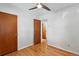 Bedroom with hardwood floors and ample closet space; neutral color scheme at 12162 W Dakota Dr, Lakewood, CO 80228