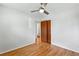 Neutral bedroom with hardwood floors, ceiling fan and double closet at 12162 W Dakota Dr, Lakewood, CO 80228