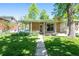 Charming home with a covered porch and a well-manicured front yard at 12162 W Dakota Dr, Lakewood, CO 80228