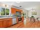 Efficient kitchen with stainless appliances, wood cabinets, and easy access to the outdoor patio at 12162 W Dakota Dr, Lakewood, CO 80228