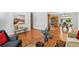 Spacious living room with gleaming hardwood floors and a seamless flow to the kitchen at 12162 W Dakota Dr, Lakewood, CO 80228