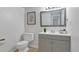 Bright bathroom features a modern vanity, framed mirror, and neutral tones, offering a serene and functional space at 9424 E Girard Ave, Denver, CO 80231