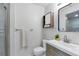 Bright bathroom showcasing a modern vanity, updated fixtures, and a convenient mirrored cabinet at 9424 E Girard Ave, Denver, CO 80231