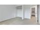 Bright bedroom features neutral carpet, closet, and an adjacent bedroom for a versatile living space at 9424 E Girard Ave, Denver, CO 80231