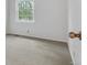 Bright empty bedroom with a large window and neutral carpet at 9424 E Girard Ave, Denver, CO 80231