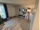 Inviting entryway with decorative mirrors, sleek bench, and modern lighting fixture creating a warm welcome at 9424 E Girard Ave, Denver, CO 80231