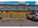 Townhome with fenced front and parking. Street view of property at 9424 E Girard Ave, Denver, CO 80231