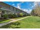 Well-maintained townhouse complex with lush green lawns at 9424 E Girard Ave, Denver, CO 80231