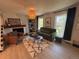 Bright living room features stylish decor, a cozy fireplace, and natural light from the windows at 9424 E Girard Ave, Denver, CO 80231