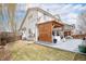 Spacious backyard featuring a covered patio with outdoor seating and a well-maintained lawn at 3764 Balderas St, Brighton, CO 80601