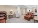 Spacious basement featuring plush seating, neutral carpet, and inviting lighting at 3764 Balderas St, Brighton, CO 80601
