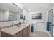 Accessible bathroom with updated vanity, neutral-toned sink, and accessible shower at 3764 Balderas St, Brighton, CO 80601