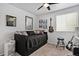 Cozy bedroom with a comfortable bed, guitar, and ample light, perfect for relaxation and creativity at 3764 Balderas St, Brighton, CO 80601
