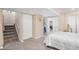 Bedroom with carpet and white trim with basement access at 3764 Balderas St, Brighton, CO 80601