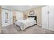 Cozy bedroom features plush carpet, mirrored accents, and lots of natural light at 3764 Balderas St, Brighton, CO 80601