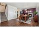 This dining area features a fireplace and hardwood floors, creating a warm and inviting atmosphere at 3764 Balderas St, Brighton, CO 80601