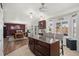 Bright, modern kitchen with a large island, seating, and an open floor plan, perfect for entertaining and Gathering gatherings at 3764 Balderas St, Brighton, CO 80601