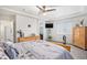 Comfortable main bedroom with soft carpet and a modern ceiling fan, perfect for relaxation at 3764 Balderas St, Brighton, CO 80601