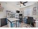 Well-organized home office with functional desks and ceiling fan at 3764 Balderas St, Brighton, CO 80601