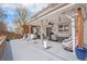 Expansive covered patio featuring outdoor furniture, string lights, and grill at 3764 Balderas St, Brighton, CO 80601