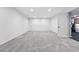 Spacious basement area with neutral colored carpet and many storage cabinets along the back wall at 5441 S Dayton Ct, Greenwood Village, CO 80111