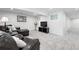 Finished basement area with comfortable leather furniture, neutral carpet and decorative accents at 5441 S Dayton Ct, Greenwood Village, CO 80111