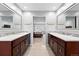 Elegant bathroom with dual sinks, granite countertops, and decorative tile accents at 5441 S Dayton Ct, Greenwood Village, CO 80111