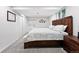 Cozy bedroom features a wood-framed bed, carpet floors, natural light, and a decorative wall hanging at 5441 S Dayton Ct, Greenwood Village, CO 80111