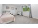 Cozy bedroom with a twin bed, dresser, carpet flooring and natural light from the exterior at 5441 S Dayton Ct, Greenwood Village, CO 80111