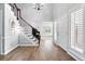 Bright foyer with wood floors, high ceilings, a staircase and direct access to the main living space at 5441 S Dayton Ct, Greenwood Village, CO 80111